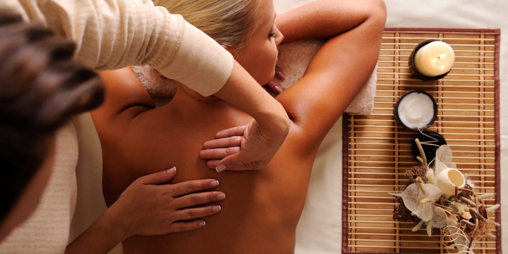 female-getting-relaxation-massage-in-beauty-salon-high-angle-view
